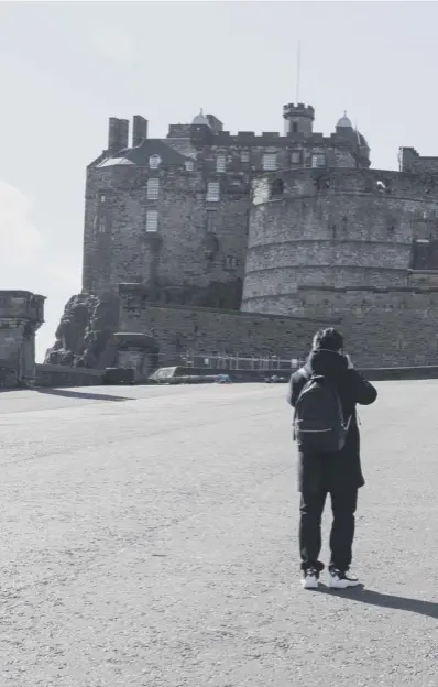  ??  ?? 0 The Esplanade in front of Edinburgh Castle is almost empty as tourists stay away with Visitscotl­and