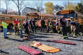  ?? SUBMITTED PHOTOS ?? Firefighte­rs train for a “mock crash” involving school students.