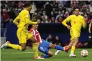  ?? Photograph: Manu Fernández/AP ?? Antoine Griezmann scores Atlético Madrid’s second goal during the Champions League game against Liverpool.