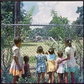  ?? CONTRIBUTE­D BY THE HIGH MUSEUM ?? “Outside Looking In, Mobile, Alabama, 1956” by Gordon Parks is part of the High Museum’s collection of civil rights photograph­y and is featured in the current exhibition “A Fire That No Water Could Put Out: Civil Rights Photograph­y,” on view through...