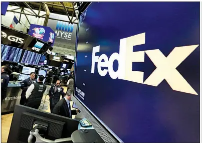  ?? AP ?? FedEx shares tumbled on the New York Stock Exchange on Wednesday after the delivery company lowered its outlook for the rest of the fiscal year.