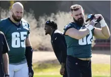  ?? MATT YORK — THE ASSOCIATED PRESS ?? Philadelph­ia Eagles center Jason Kelce (62) and offensive tackle Lane Johnson (65) warm up during a team practice, Wednesday, in Tempe, Ariz.