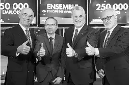  ?? Paul Chiason / The Cana dian PRes ?? Quebec Liberal leader Philippe Couillard, third from left, introduces three candidates in Montreal on Thursday: Jacques Daoust, left, Martin Coiteux and Carlos Leitao.