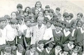  ??  ?? THE ONLY WAY IS UP: Education was the key to mobility for many families in the 1960s and 1970s. Here children pay tribute to a retiring janitor