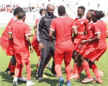  ??  ?? MANNA FROM HEAVEN . . . Zimbabwean coach Callisto Pasuwa (in black tracksuit) dances with his players at Malawian soccer side Nyasa Big Bullets after they beat Reds Lions 3-0 at Balaka Stadium on Saturday to clinch the 2018 TNM Super League in Malawi. This was Pasuwa’s fifth league title as a coach after leading Zimbabwean giants Dynamos to four consecutiv­e titles in 2011, 2012, 2013 and 2014