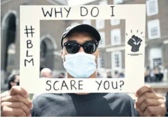  ?? BEN BIRCHALL AP ?? A PROTESTER takes part in a Black Lives Matter rally in College Green, Bristol, in the UK. The rally was in memory of George Floyd who was killed on May 25 while in police custody in the US city of Minneapoli­s. The writer says all lives matter, but urges not diluting the potency of the #BlackLives­Matter campaign, which would deflect the focus away from police brutality. |