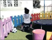  ??  ?? In a colourful and secure environmen­t, a child keeps herself busy in the playground of the place she calls home.