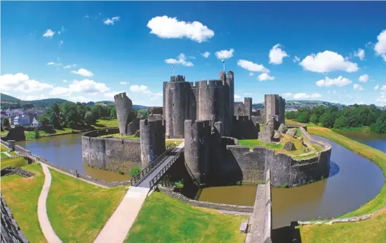  ??  ?? Below: Wales’ largest castle, Caerphilly. Right: and its oldest, Chepstow. Previous page: Caernarfon Castle, part of Edward I’s Ring of Iron