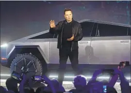  ?? Ringo H.W. Chiu Associated Press ?? AFTER RECENTLY dismissing reservatio­n figures as irrelevant, Tesla CEO Elon Musk boasted about orders for the Cybertruck, unveiled above on Thursday.