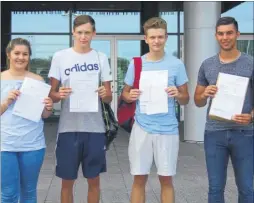  ??  ?? Megan Parrott, Scott Fox, Aaron Biggs and Bobby Liston collect their GCSE results at New Line Learning Academy