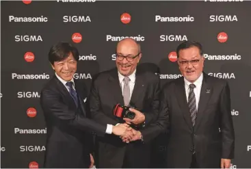  ??  ?? From left to right: Mr Kazuto Yamaki of Sigma, Dr Andreas Kaufmann of Leica, and Mr Junichiro Kitagawa of Panasonic