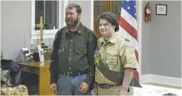  ?? BY ROGER PIERSON ?? Eric Thompson, pictured here with his proud father Kyle, after receiving his Star Scout Rank, just two major steps and seven merit badges away from earning the Eagle Scout honor. Troop 36 meets and holds its quarterly Court of Honor at Trinity...