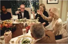  ??  ?? Former Playboy Enterprise­s CEO Christie Hefner (right) toasts her guests during a dinner party in a scene from “City So Real.”