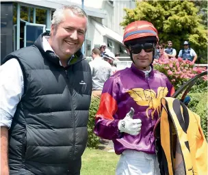  ?? RACE IMAGES ?? Trainer Fraser Auret, left, and senior jockey Johnathan Parkes teamed for their 100th success together when Massiff Princess won at New Plymouth yesterday.