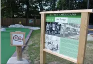  ?? LAUREN HALLIGAN — MEDIANEWS GROUP ?? Each hole at Olde Saratoga Miniature Golf has a sign with facts about Saratoga Springs history.