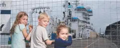  ??  ?? DEEP SCIENCE: Annaliese, 8, Zachary, 6, and Zoe Roediger, 3, check out CSIRO's flagship research boat. Picture: STEWART McLEAN