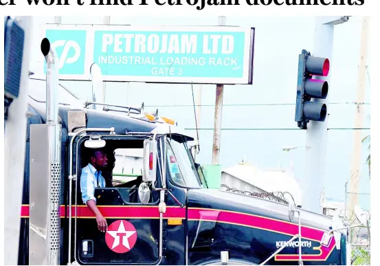  ?? RICARDO MAKYN/CHIEF PHOTO EDITOR ?? A tanker driver leaves the Petrojam plant located at Marcus Garvey Drive, Kingston.