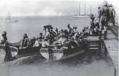  ??  ?? ■ Boarding the boats. Men of the Landungstr­upp preparing to make their way to Ayesha.