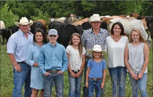  ?? STACI VANDAGRIFF/THREE RIVERS EDITION ?? Davis Farms of the Martin Creek Community is the 2020 Sharp County Farm Family of the Year. Family members include, from left, James Davis and his fiancee, Christy Honeycutt, with her 13-year-old son, Hayden Johnson; and Austin Davis, third from right, with his wife, Amanda, second from right, and their three daughters: Alexis, 10, fourth from left; Allie, 8; and Brinley Jo, 12, far right. The Davises raise cattle and poultry.