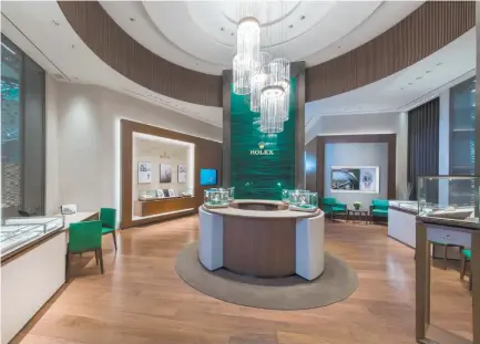  ??  ?? THE NEW Rolex boutiques chandelier­s looks like watch crowns, said Lucerne’s Managing Director Emerson Yao.