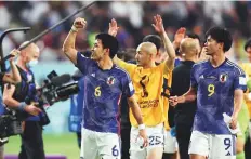  ?? Reuters ?? ■ Japan’s Wataru Endo, Daizen Maeda and Kaoru Mitoma celebrate after the match.
