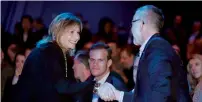  ??  ?? General Motors CEO Mary Barra shakes hands at the official debut of the new 2019 Chevrolet Silverado 1500 at the Detroit Auto Show.