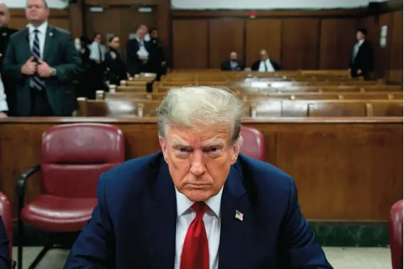  ?? — AFP ?? Former US president Donald Trump attends the first day of his trial for allegedly covering up hush money payments linked to extramarit­al affairs at Manhattan Criminal Court in New York City on Monday.