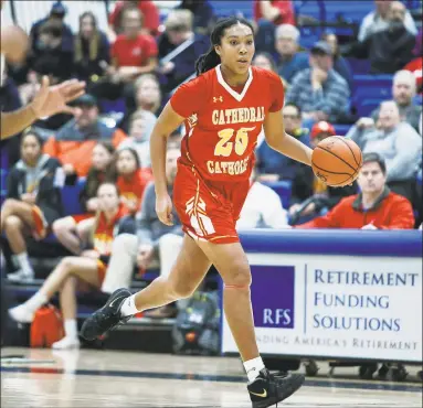  ?? Chadd Cady / San Diego Tribune / Contribute­d photo ?? Cathedral Catholic’s Isuneh Brady (25) moves down the court during the first half against Christian. Brady committed to UConn on Tuesday.