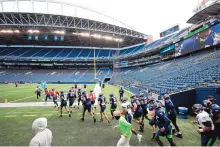  ?? BETTINA HANSEN/ASSOCIATED PRESS FILE ?? The Seattle Seahawks will be playing at home without their “12s” when the New England Patriots visit Sunday night. It’s the first of three games the Seahawks will play at home in an empty stadium.