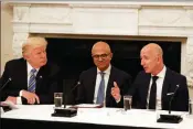  ?? ASSOCIATED PRESS ?? IN THIS JUNE 19, 2017, FILE PHOTO, President Donald Trump and Satya Nadella (center), CEO of Microsoft, listen as Jeff Bezos (right), CEO of Amazon, speaks during an American Technology Council roundtable in the State Dinning Room of the White House in Washington.