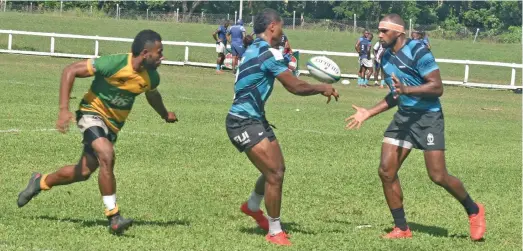  ?? Photo: Waisea Nasokia ?? 2016 Rio Olympian Semi Kunatani (right) receives a pass as he plays for Fijian Barbarians in the Fiji Bitter Malomalo 7s tournament at Lawaqa Park, Sigatoka, on May 6, 2022.