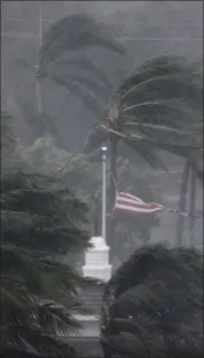  ?? DAVID GOLDMAN - ASSOCIATED PRESS ?? An American flag is torn as Hurricane Irma passes through Naples, Fla., on Sunday.
