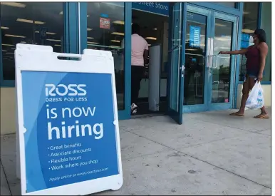  ?? (AP/Wilfredo Lee) ?? A sign announces job openings outside a Ross Dress for Less store in North Miami Beach, Fla. earlier this month. The number of laid-off workers seeking unemployme­nt benefits last week was 1.3 million, the Labor Department reported.