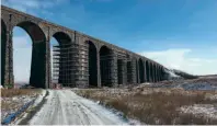  ??  ?? Majestic Ribblehead Viaduct in February’s snow, surrounded by huge scaffoldin­g towers built for the repairs to take place. NETWORK RAIL