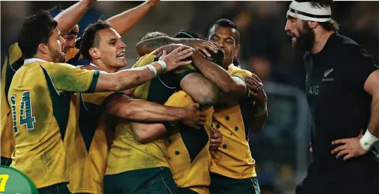  ?? GETTY IMAGES ?? Game of brag: Australia celebrate a try in their win over the All Blacks in August, the first over their rivals since 2011