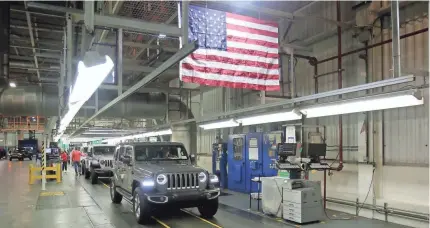  ?? DETROIT FREE PRESS ?? A Jeep Wrangler rolls off the production line at the Toledo North Assembly Plant in Ohio in November.