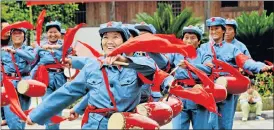  ?? /AFP Photo ?? Beloved leader: People in Red Army uniforms celebrate the opening of the Communist Party congress where President Xi Jinping declared that China was entering a ‘new era’.