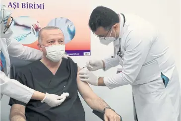  ?? REUTERS ?? Turkish President Tayyip Erdogan receives a shot of the Sinovac vaccine in Ankara on Thursday.
