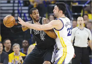  ?? AP Photo/Marcio Jose Sanchez ?? San Antonio Spurs’ LaMarcus Aldridge, left, is defended by Golden State Warriors’ Zaza Pachulia during Game 2 of the Western Conference finals May 16 in Oakland, Calif.