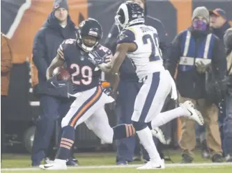  ?? DAVID BANKS/AP ?? Rams safety Lamarcus Joyner closes in on Bears running back Tarik Cohen in the first half.