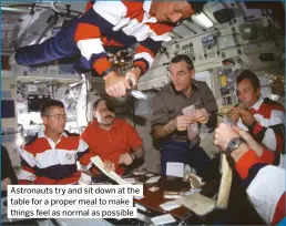  ?? ?? Astronauts try and sit down at the table for a proper meal to make things feel as normal as possible