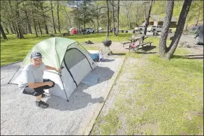 ?? (NWA Democrat-Gazette/Flip Putthoff) ?? Steve Pereira of Fayettevil­le, experience camper, shows his campsite on April 13 at Devil’s Den State Park in Washington County. Visit nwaonline.com/photo for today’s photo gallery.