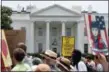  ?? ALEX BRANDON — THE ASSOCIATED PRESS ?? Activists march past the White House to protest the Trump administra­tion’s approach to illegal border crossings and separation of children from immigrant parents, Saturday in Washington.