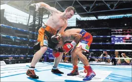  ?? Dave Hunt Reuters ?? Manny Pacquiao, right, needed more support from his corner in the upset loss to Jeff Horn, say Pacquiao’s promoter, Bob Arum, and his manager, Michael Koncz.