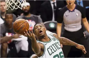  ??  ?? Target locked: Boston Celtics’ Marcus Smart going for the basket against Toronto Raptors on Sunday. — AP