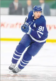  ?? CP PHOTO ?? Toronto’s John Tavares skates during the second period of the NHL pre-season game between the Maple Leafs and the Ottawa Senators in Lucan, Ontario on Tuesday.