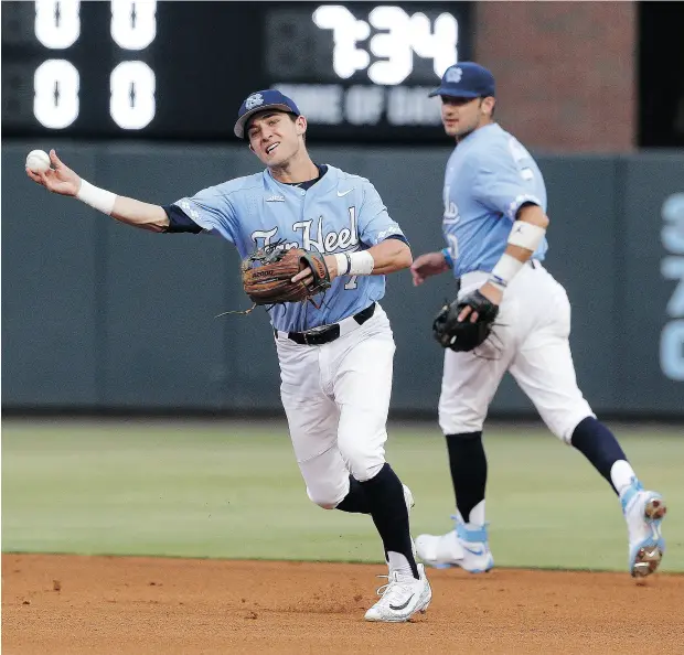  ?? GERRY BROOME / THE ASSOCIATED PRESS FILES ?? North Carolina shortstop Logan Warmoth — the Blue Jays’ No. 1 pick — throws out a runner in a recent NCAA tournament regional game.