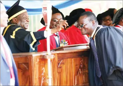  ?? (Picture by Justin Mutenda) ?? President Mnangagwa caps Zimbabwe Defence Forces Director of Public Relations Colonel Overson Mugwisi who graduated with a Master of Science in Internatio­nal Relations Degree at the University of Zimbabwe yesterday. — (See story on Page 2). —