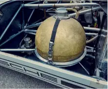  ??  ?? Below left: Vestigial rollbar offered minimal protection in the event of an accident – but weighed little…
Below right: Spherical fuel tank was pressurise­d using a football bladder, but the system proved troublesom­e. Without Piëch’s permission, the mechanics installed an electric pump (just visible to the left of the tank) to solve fuel delivery problems