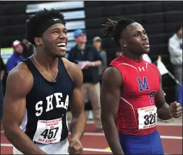  ?? Photo by Ernest A. Brown ?? Shea High senior Jaylen Smith, left, stands with Mount Pleasant senior Fredrick Mallay as they await the results of the boys’ 55-yard dash state finals Saturday. Smith and Mallay will be teammates on the URI football team this coming fall.